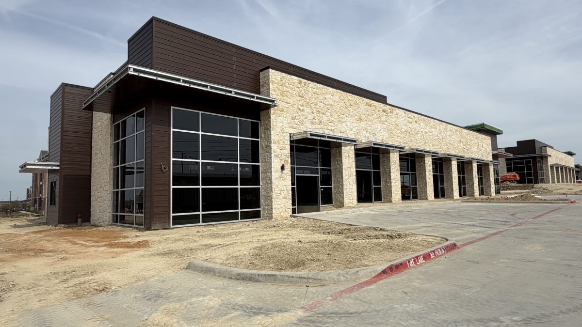 Central Plaza Shops B facade complete, storefronts going in, October 25, 2026