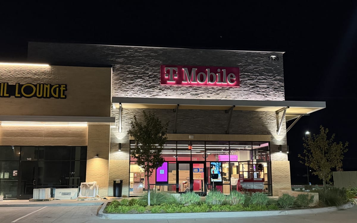 T-Mobile storefront signage lit, October 19, 2026