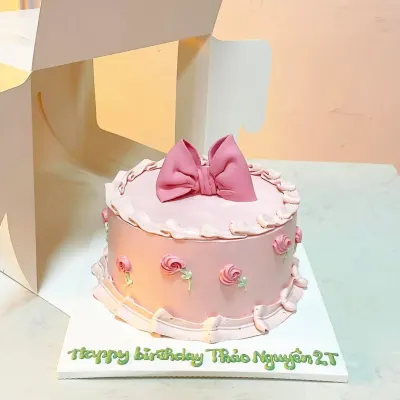 Bánh nơ hồng lớn viền bèo hoa hồng