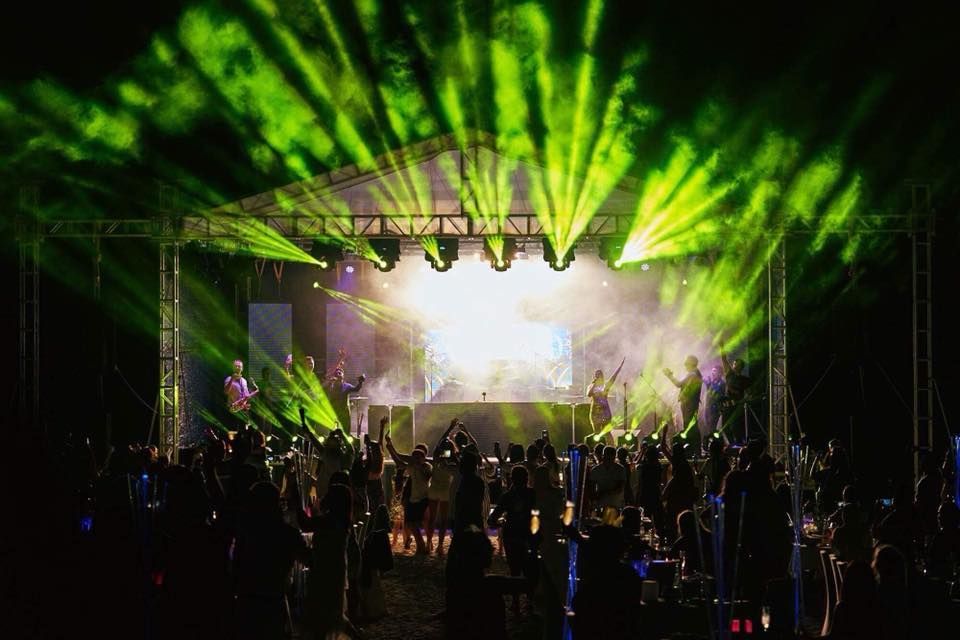 Jam Hot festival stage set up with bright green lighting