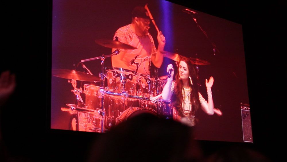 Jam Hot singer & drummer on large festival screen