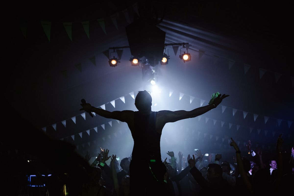 Silhouette of Jam Hot singer infront of festival crowd