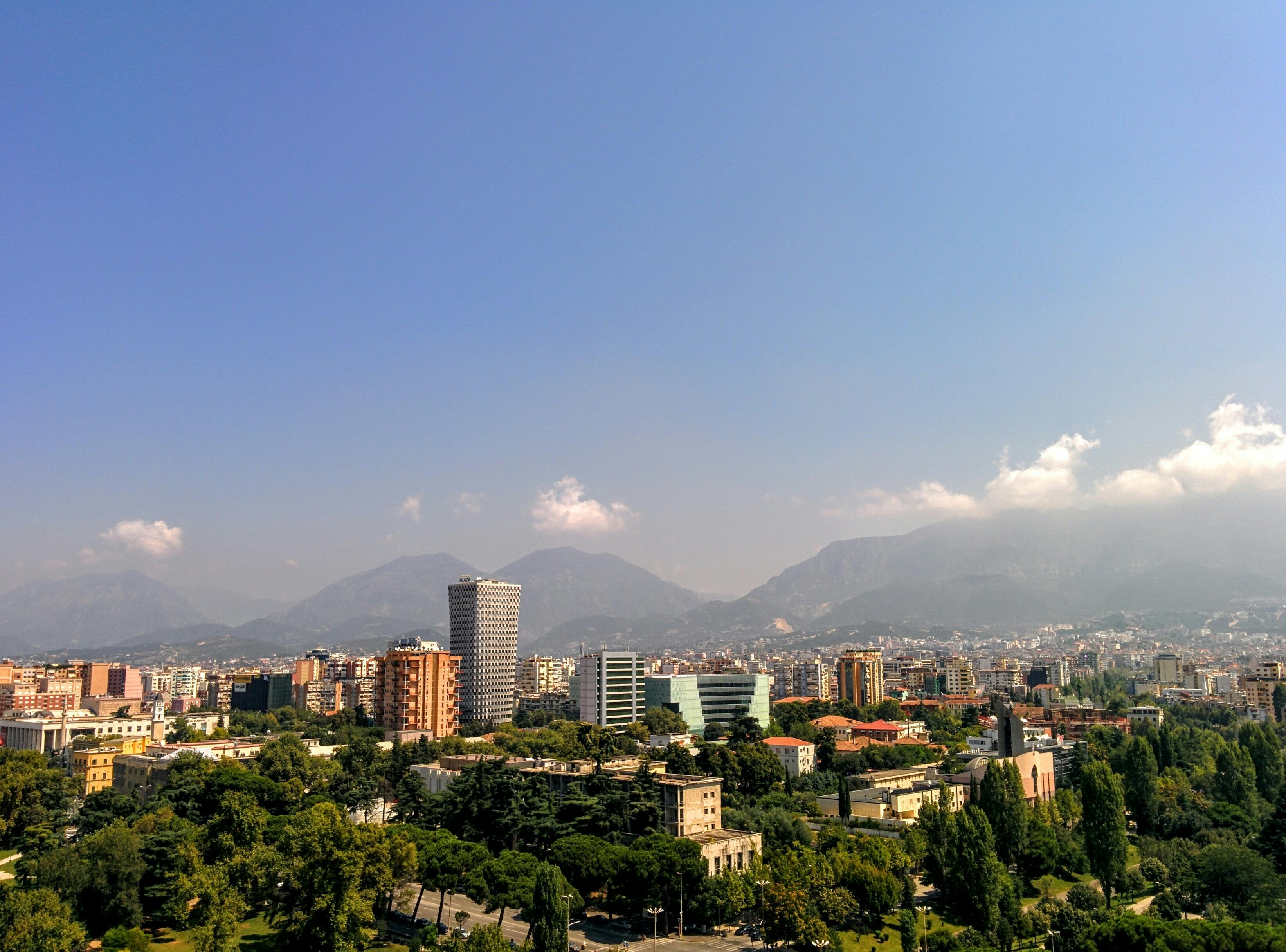 Albanian traditional clothing and landscape with mountains
