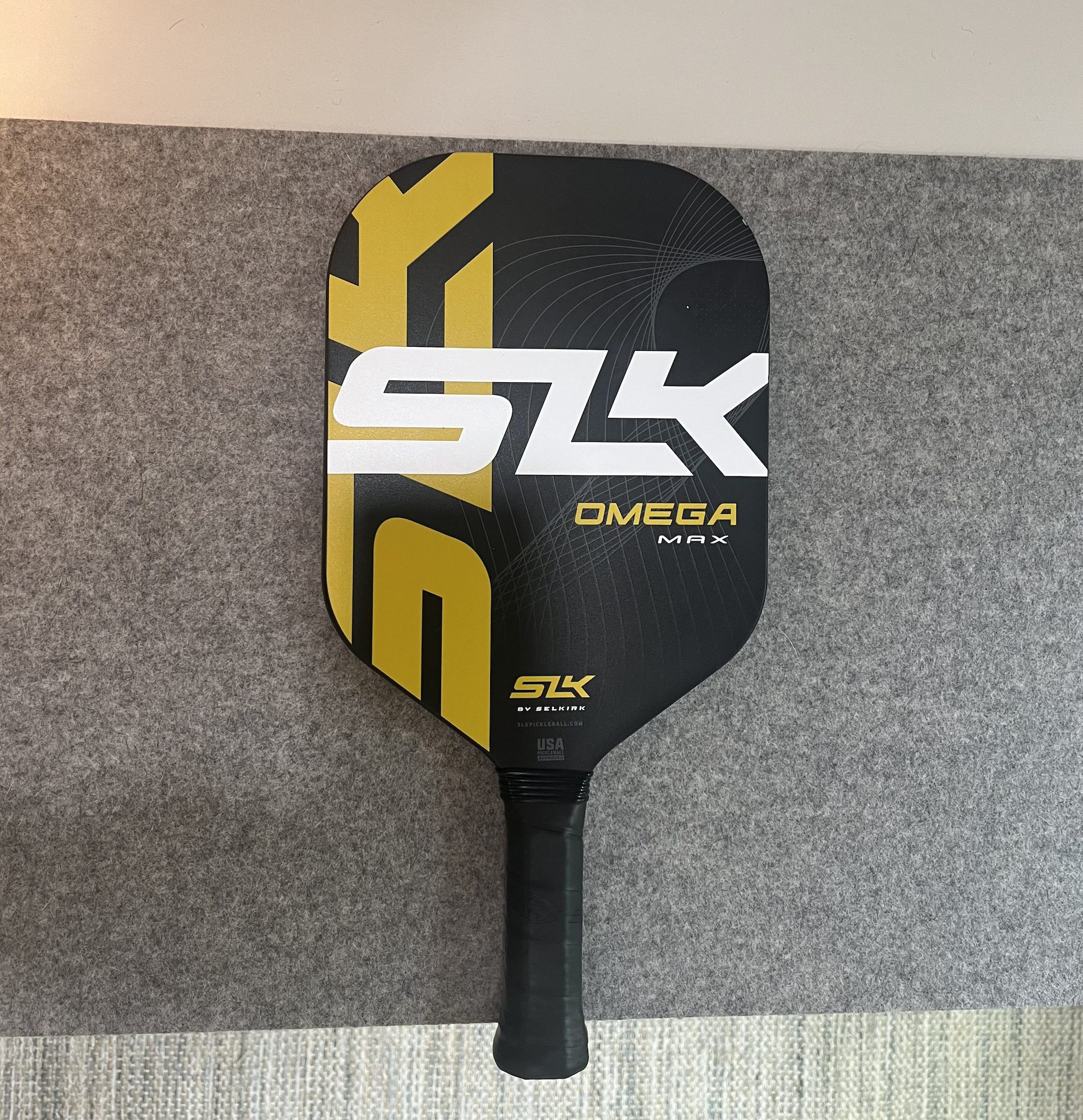 the selkirk omega max paddle shown on a table