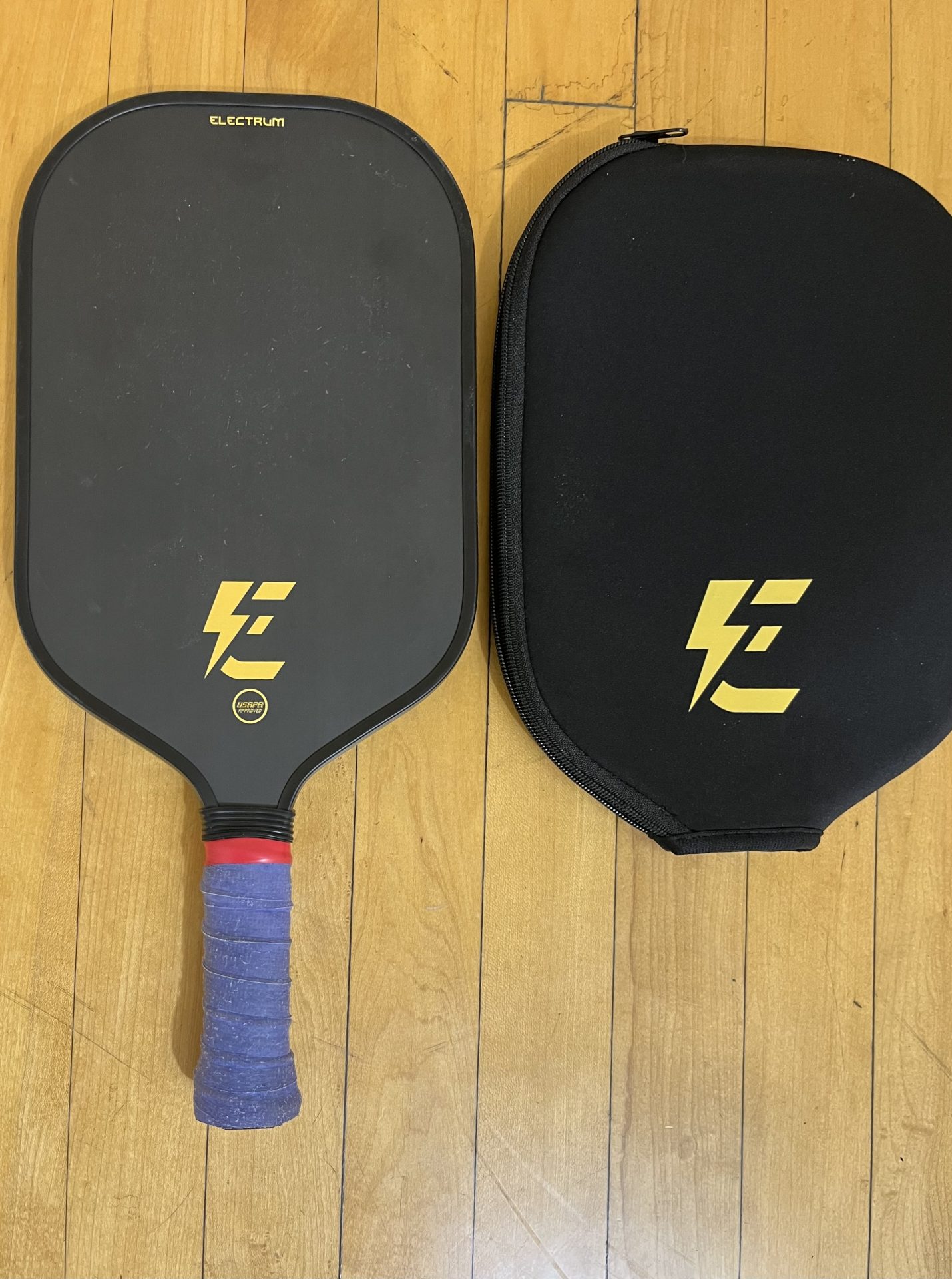 The Electrum Model E and Paddle head cover shown on court floor