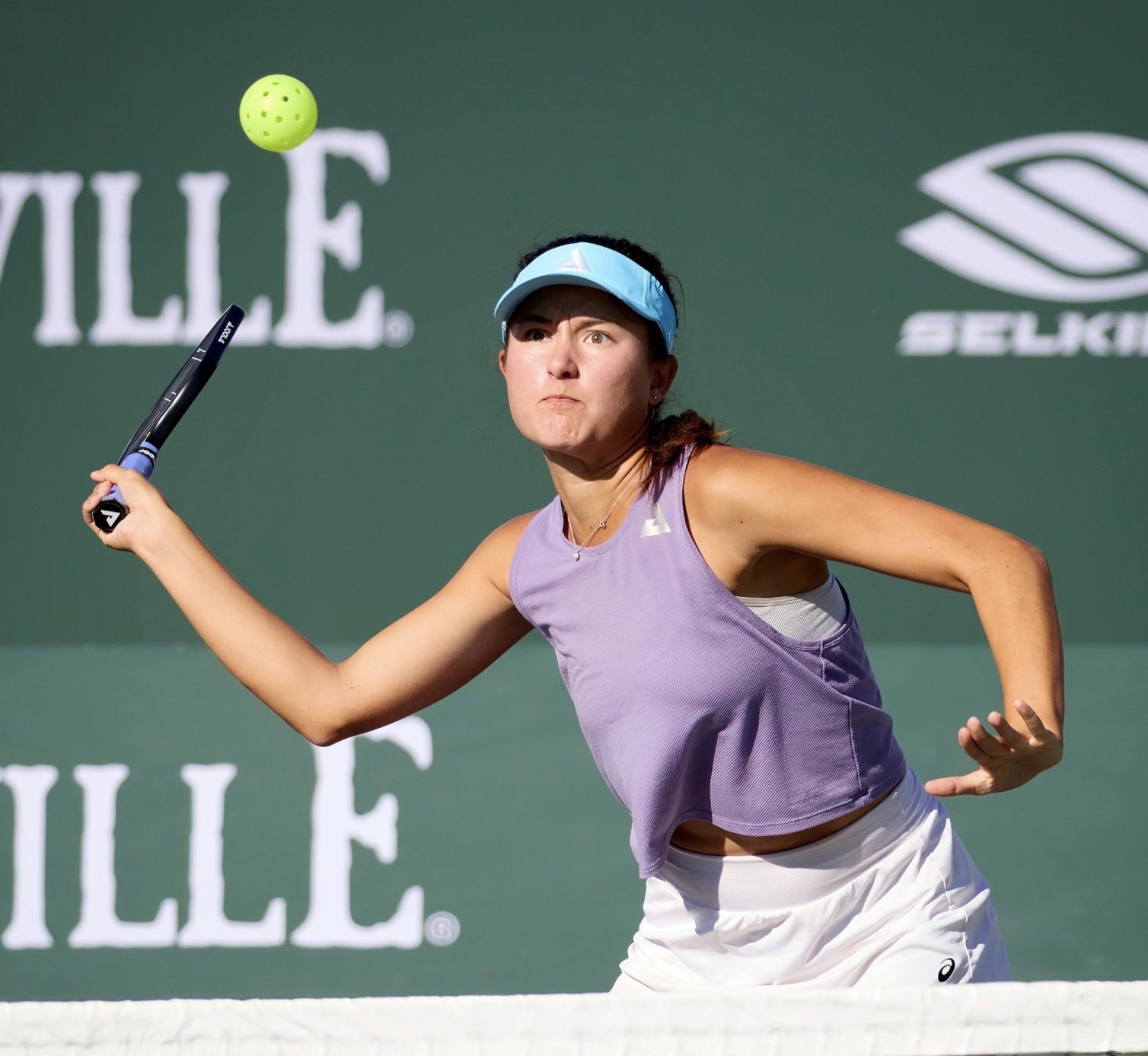 Anna Bright at Indian Wells hitting a spiker