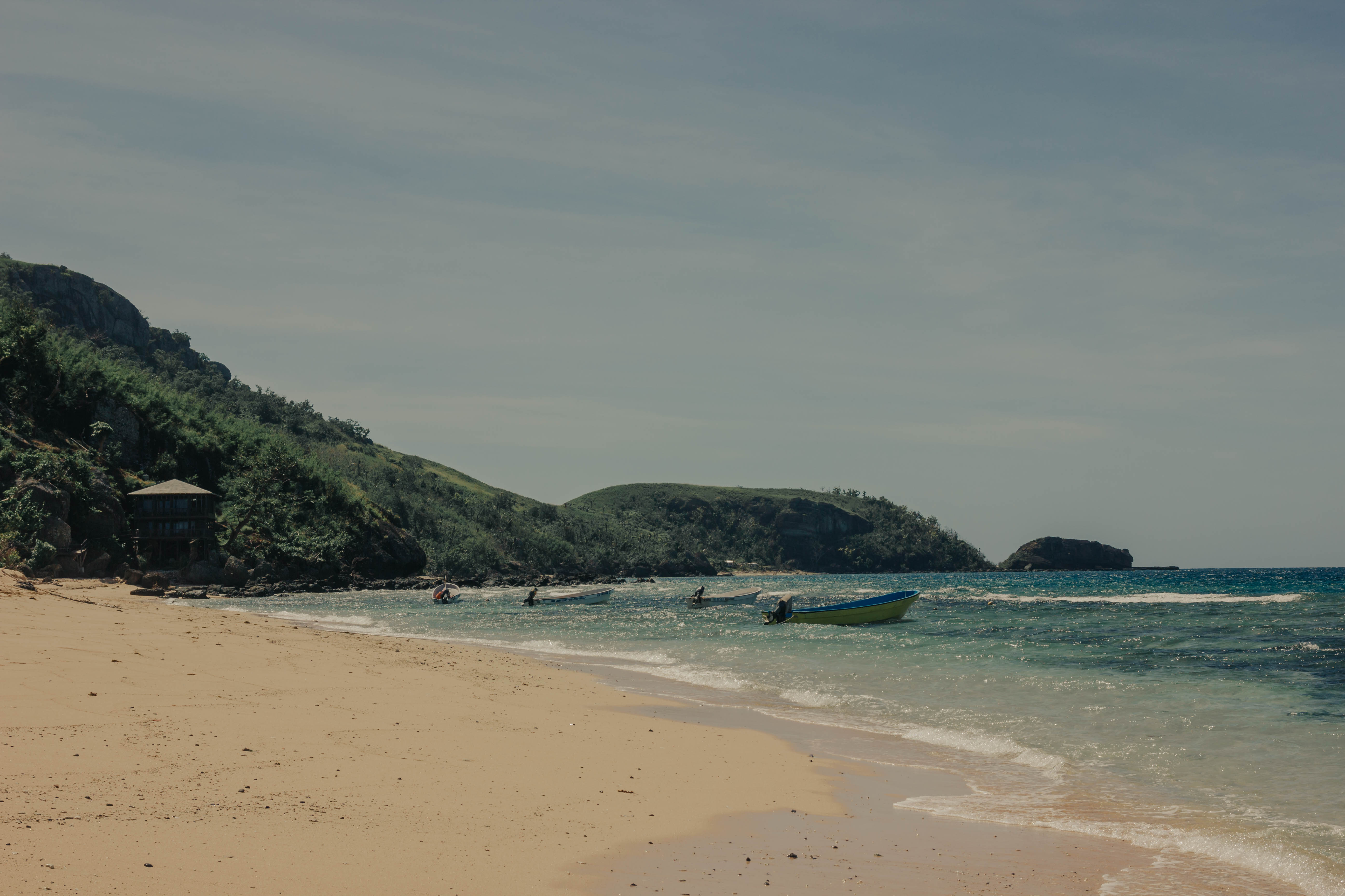 Beach view with boats in the water