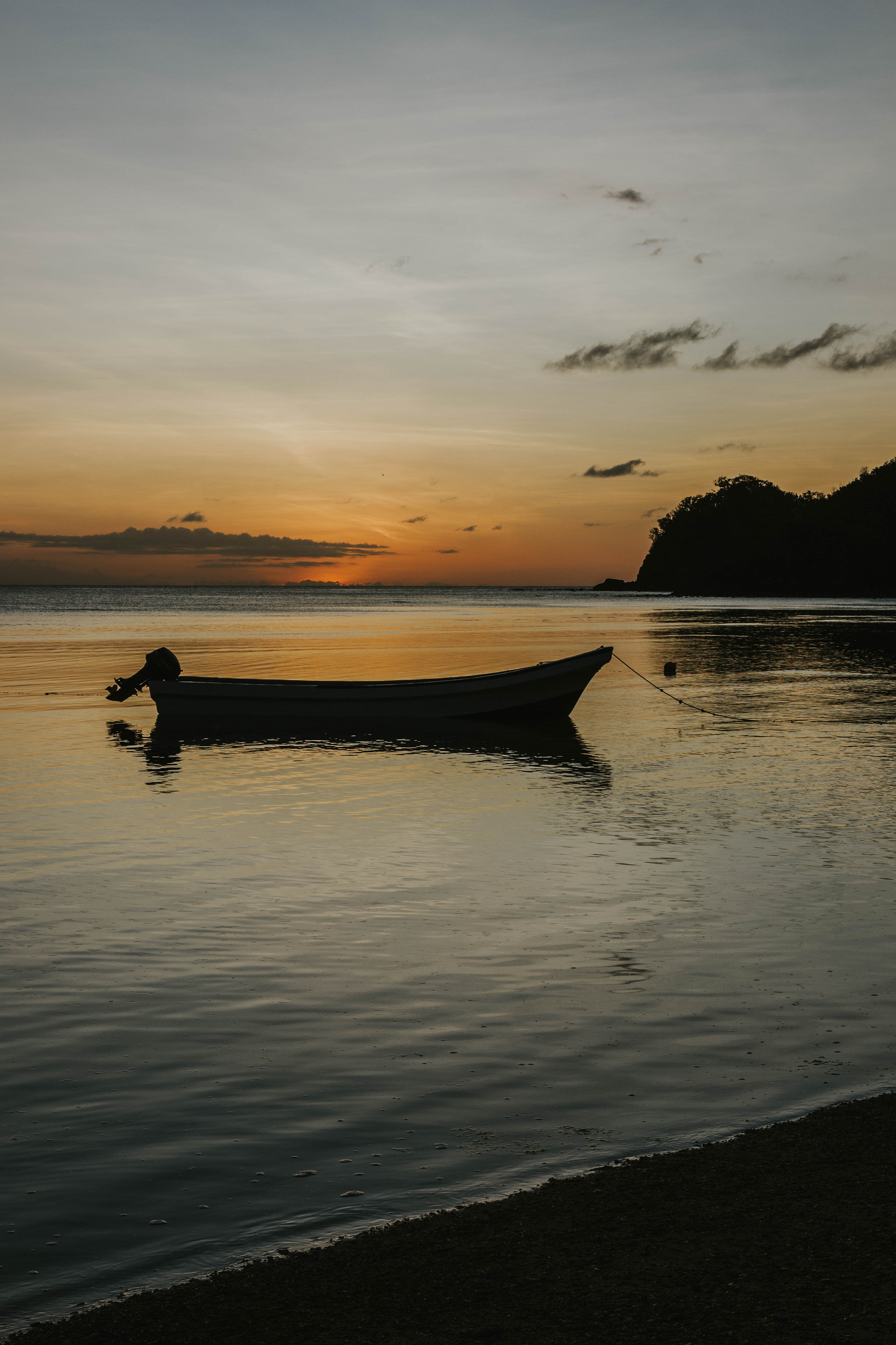 Silhouette of boat at sunset