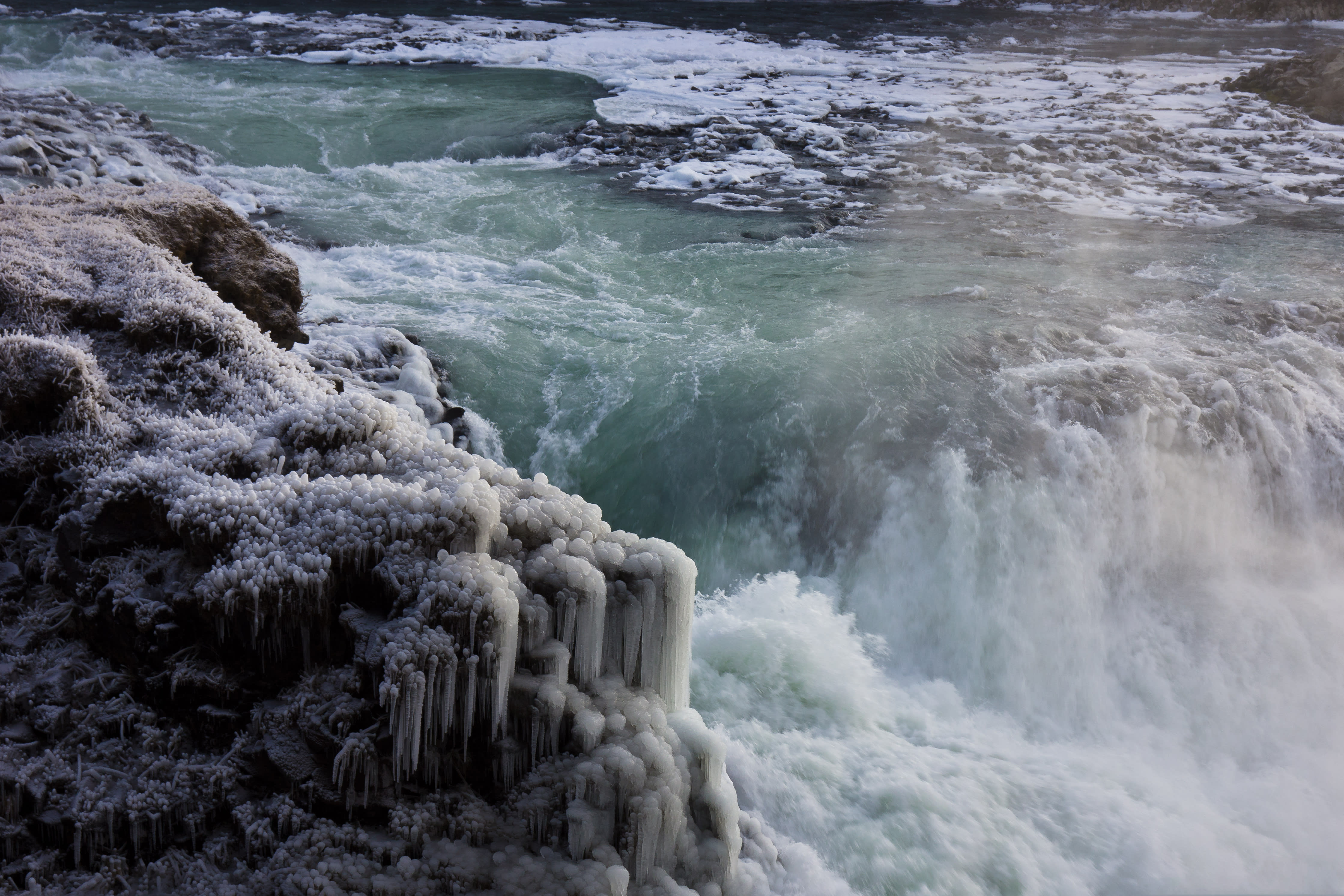 Waterfall with icicles on rocks