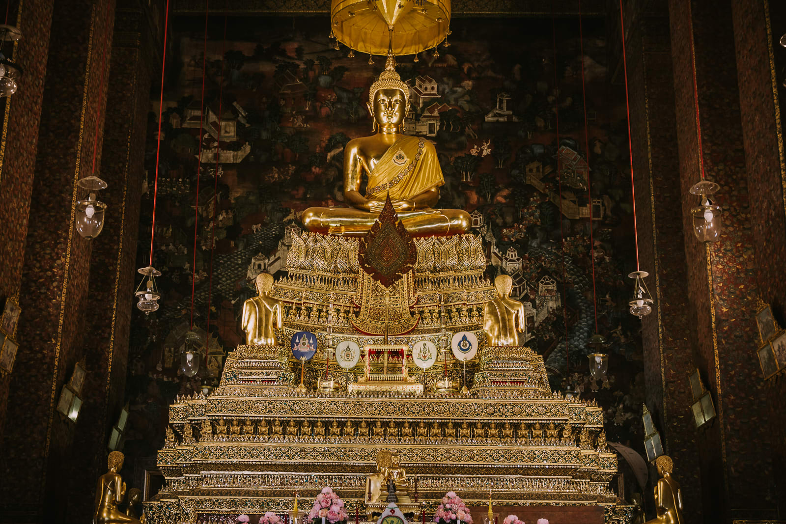 Golden Buddha on ornate gold pillar