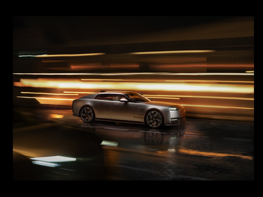 Jaguar Type 01 electric GT in Compelling Blue showing the long bonnet and cab-rearward design at the New York reveal