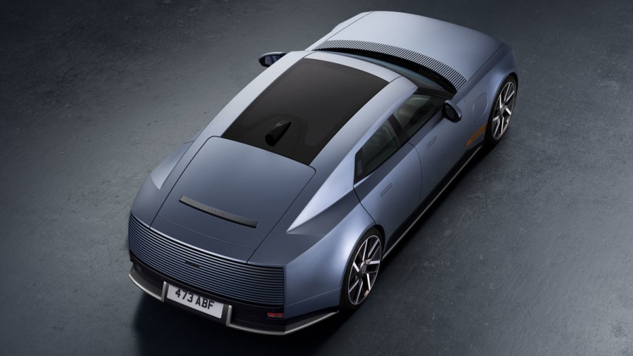 Jaguar Type 01 rear three-quarter view showing the strike-through tail light treatment and frameless doors