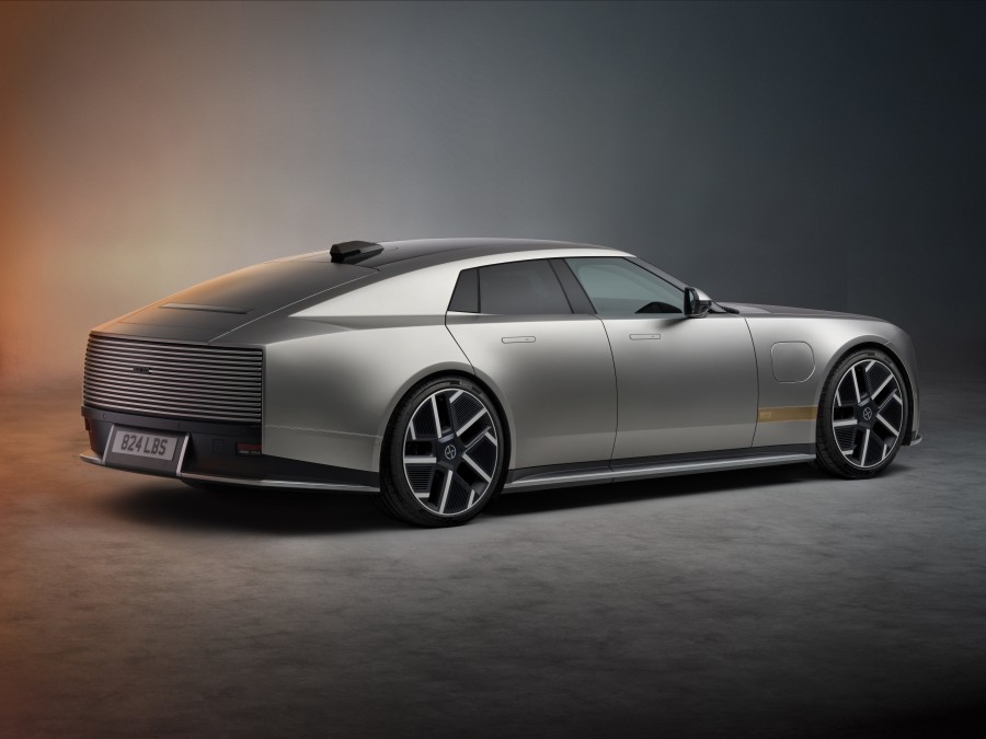Jaguar Type 01 side profile showing the 5.2 metre length, 23-inch wheels and low roofline in Visionary Silver