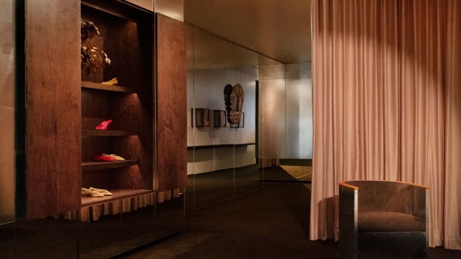 Le Monde Béryl Madison Avenue flagship boutique interior with wood cabinetry and dark carpet