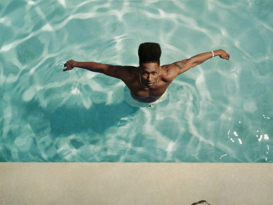 Lucky Daye photographed by Micaiah Carter wearing a patterned shirt, styled for the ALOUD album era