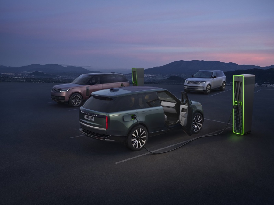 Range Rover Electric plugged in at a public fast charger demonstrating 350 kW DC ultra-fast charging capability