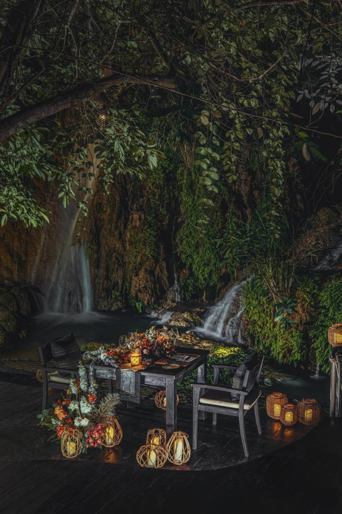 Private candlelit dining beside the waterfall at Avana Retreat