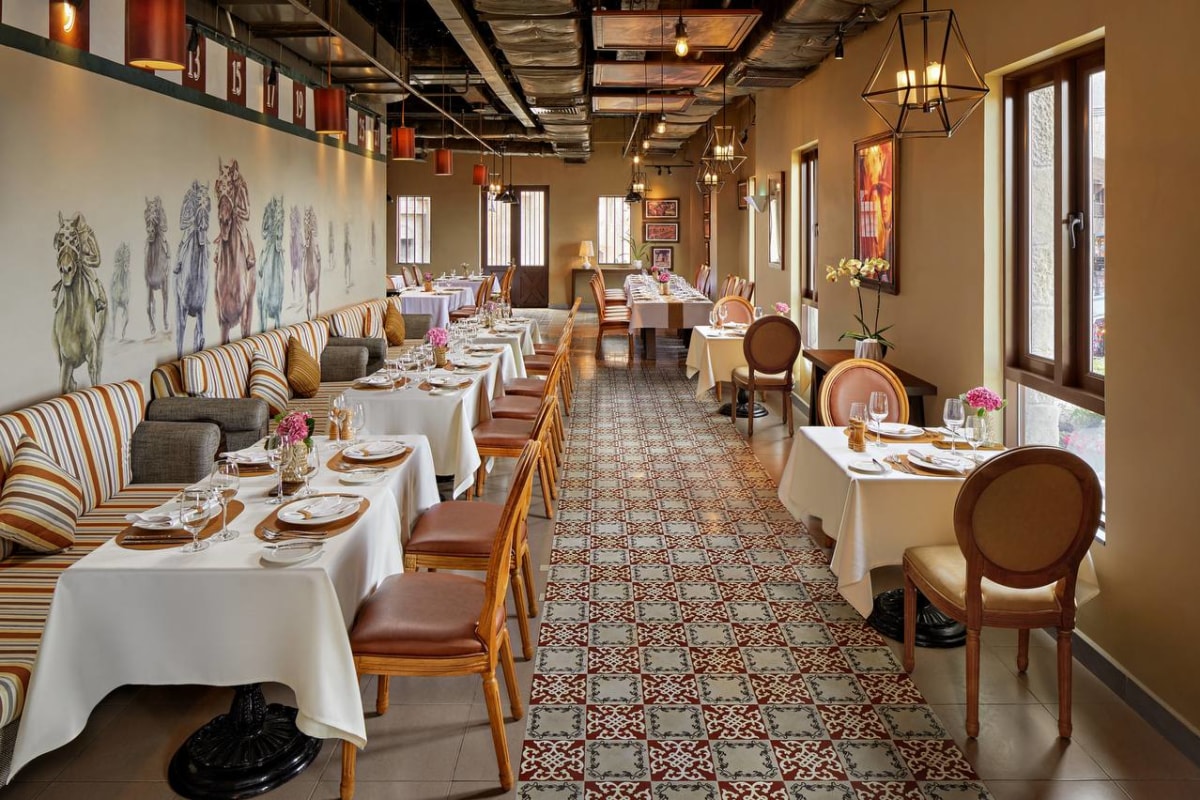 L'Etable restaurant interior with horse mural and formal dining, Mercure Bana Hills