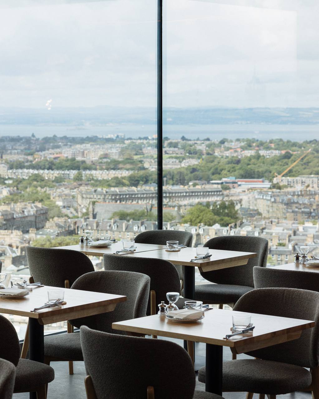 Cafe Calton building with distinctive pyramid roof and garden landscaping on Calton Hill