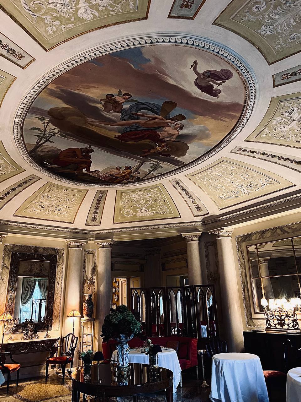 Domed dining room with frescoed ceiling and gilded mirrors at Passalacqua