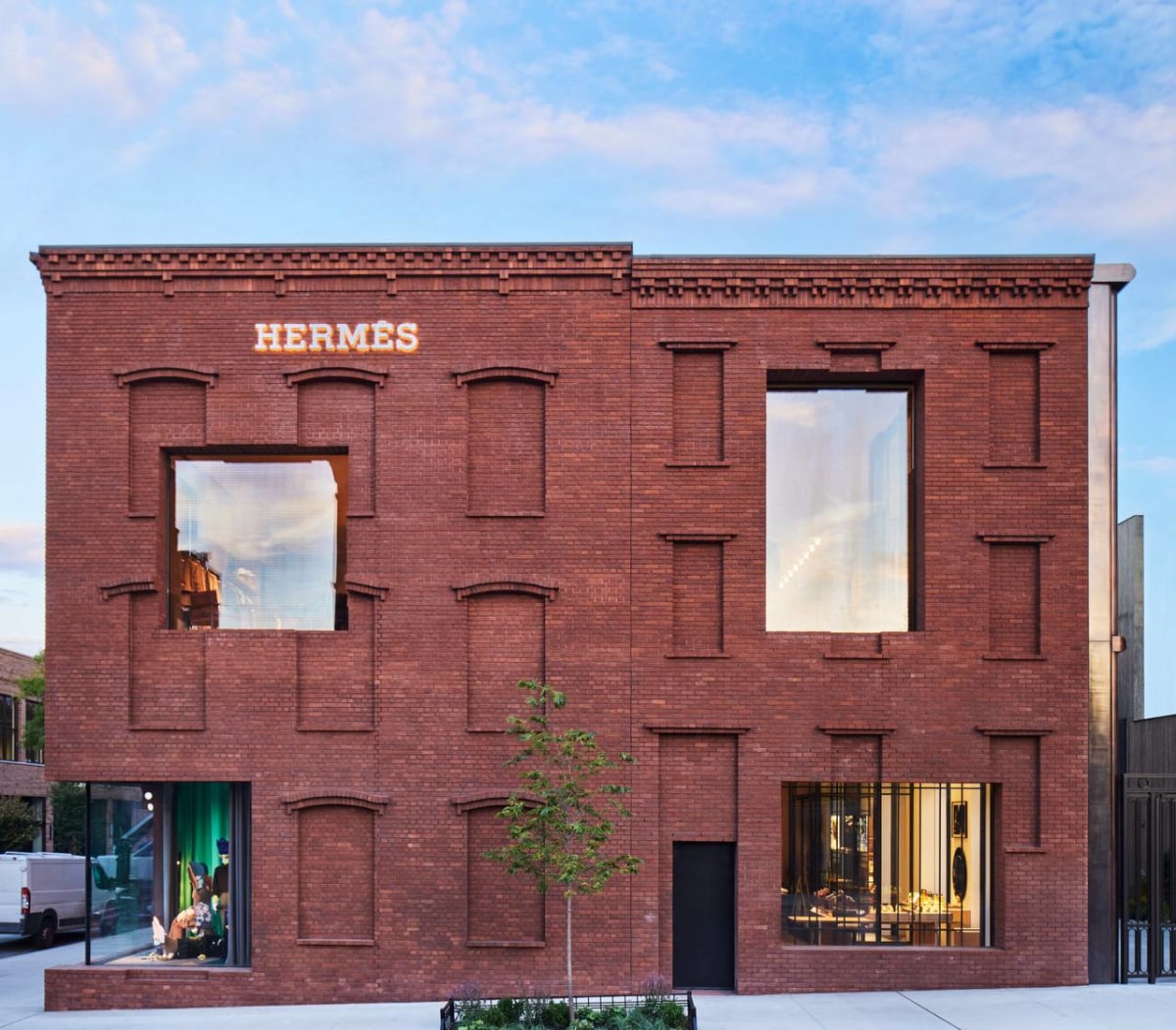Hermes Williamsburg brick exterior with window displays and artist programme