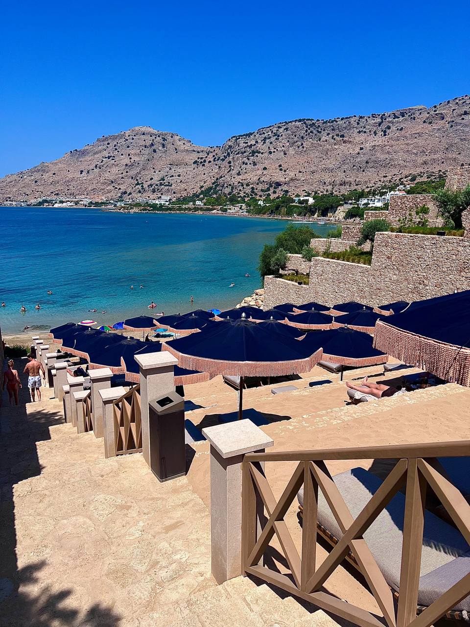 Beachfront terraces cascading down to turquoise waters at Amoh Rhodes