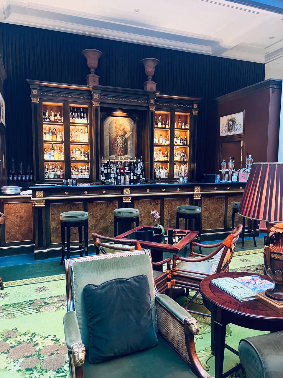 Bar lounge with carved lion armchairs and classic Italian elegance