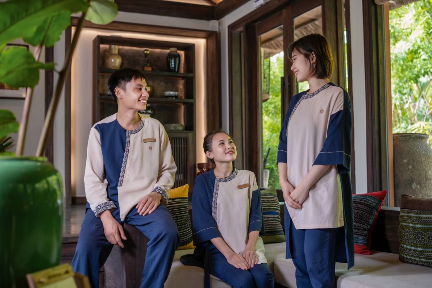 Avana Retreat staff in traditional-inspired uniforms at the resort lobby