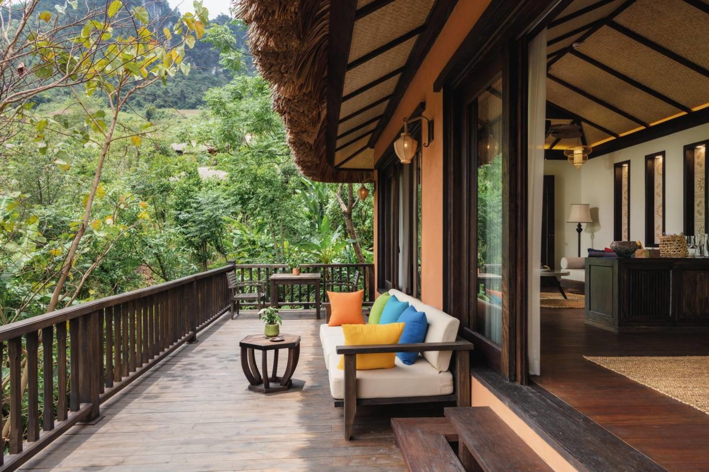 Villa deck with cushions overlooking lush jungle at Avana Retreat