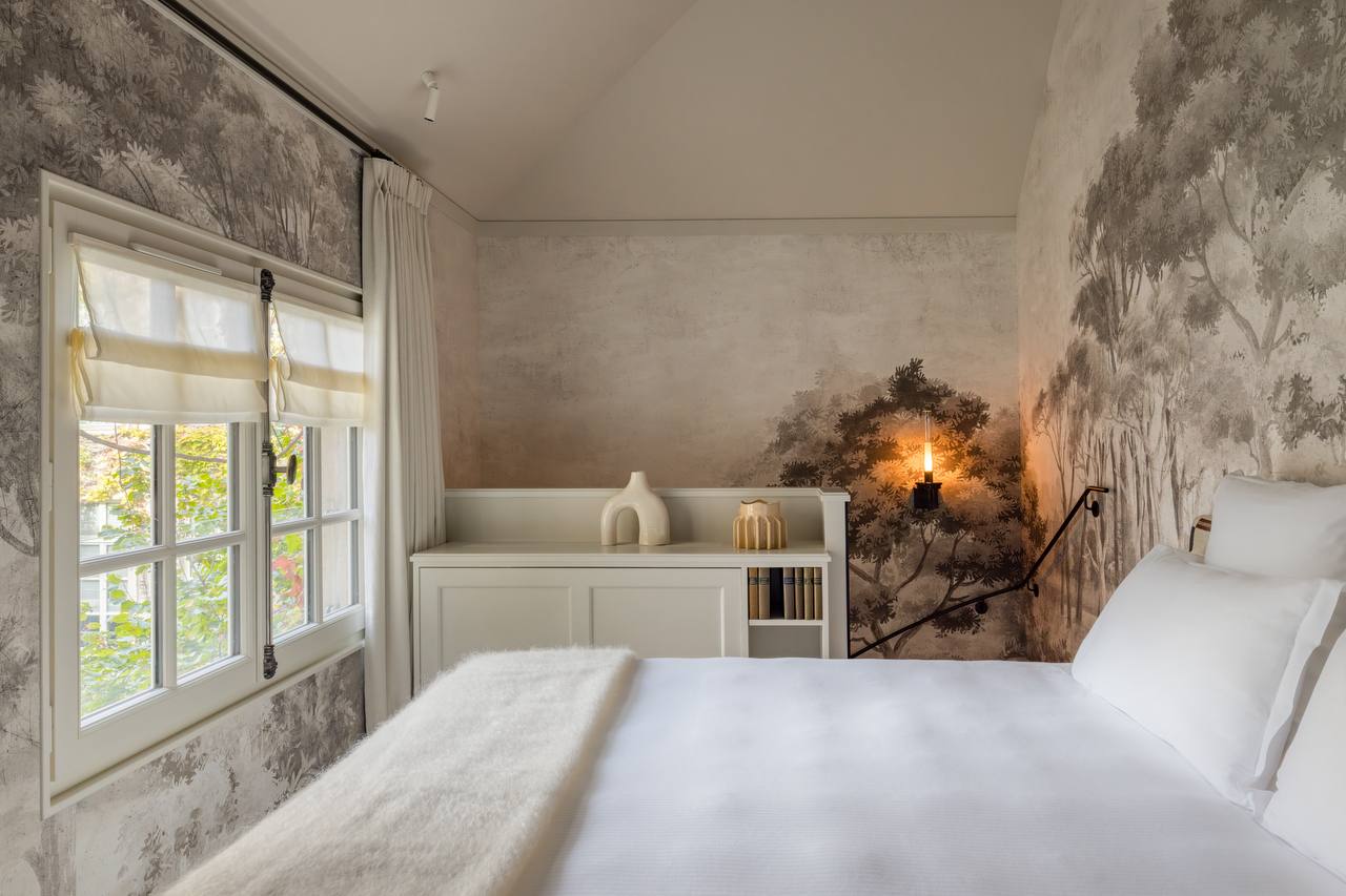 Suite with grisaille forest mural at Pavillon de la Reine
