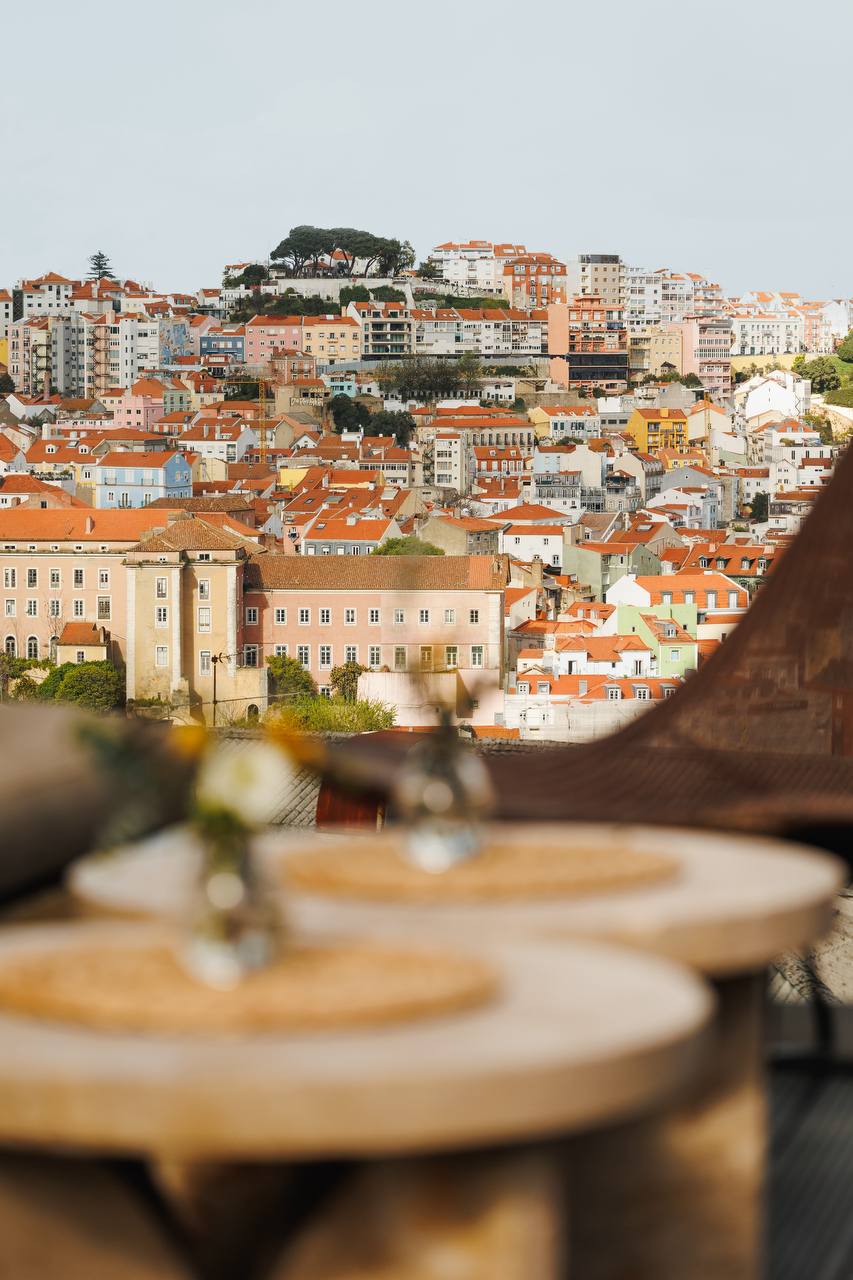 Lumi Rooftop terrace with panoramic views over Lisbon's terracotta rooftops and the Tagus River