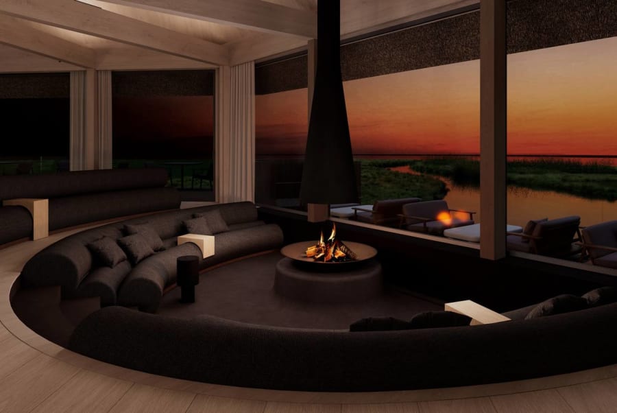 Sunken lounge with fire pit at sunset overlooking wetlands