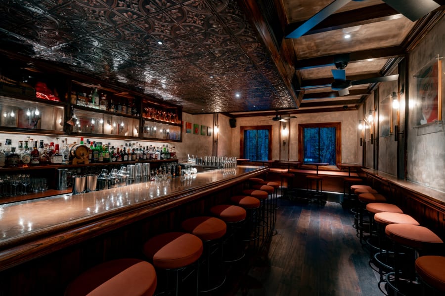 Second floor bar with pressed-tin ceiling at Speak Low