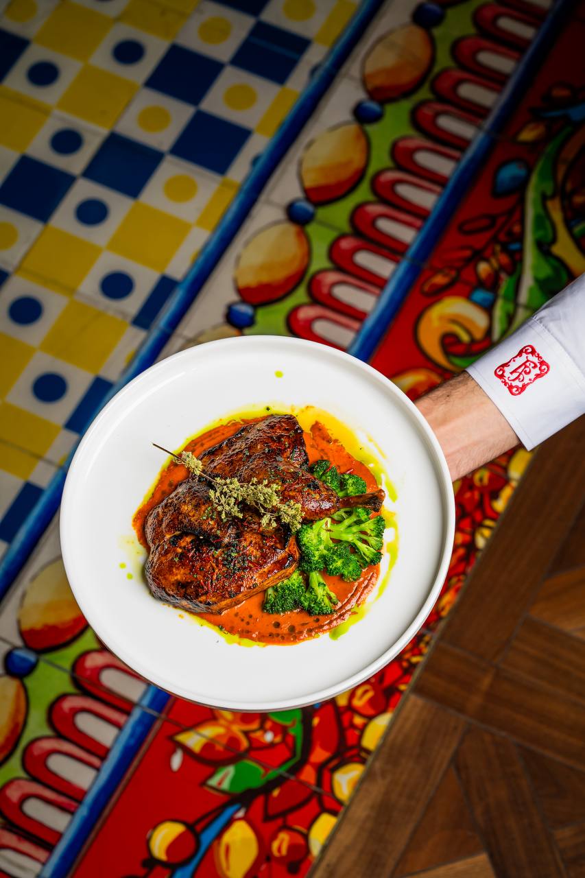 Crispy skinned cornfed chicken over a spicy sauce at Felicità