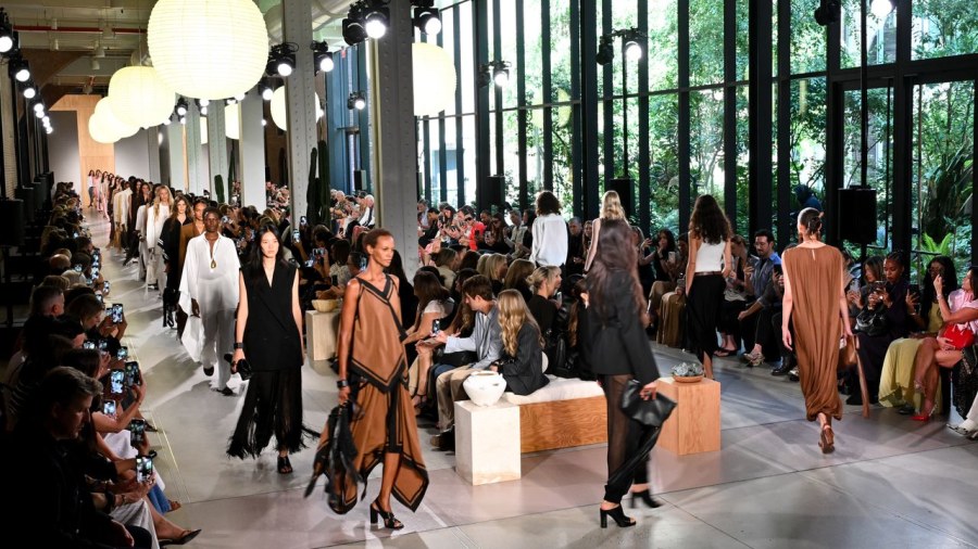 New York Fashion Week runway scene with models and designers