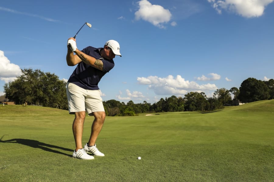 Golfer hitting an approach shot