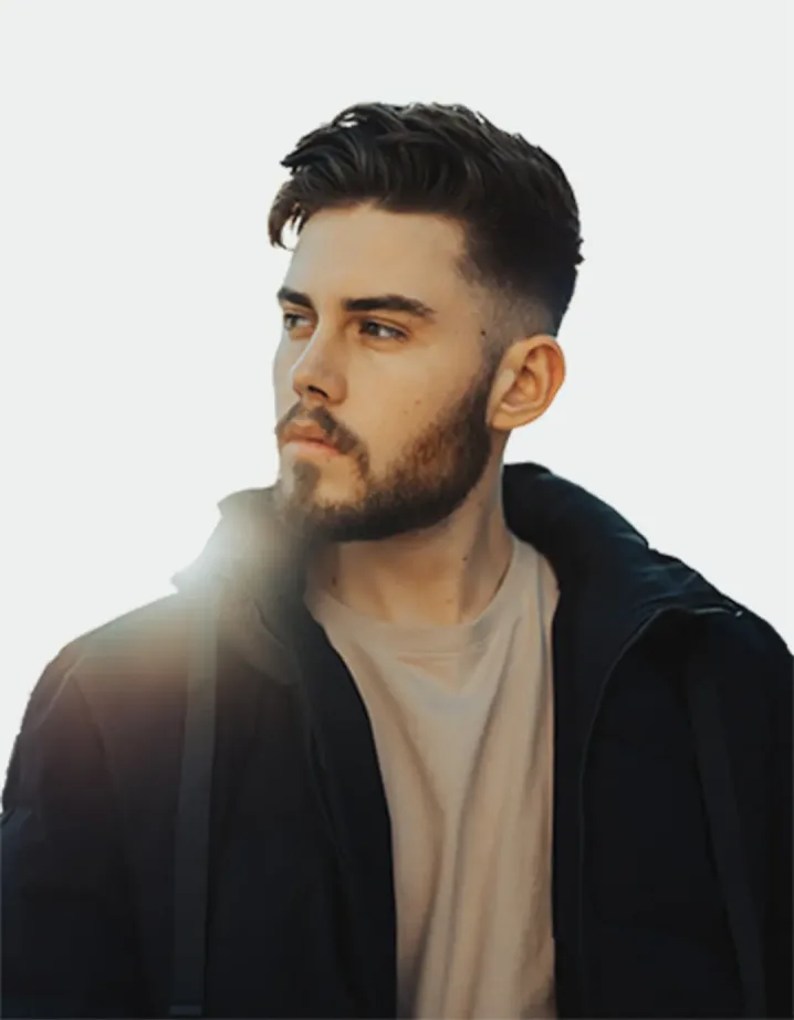 A man in a black jacket and beige T-shirt