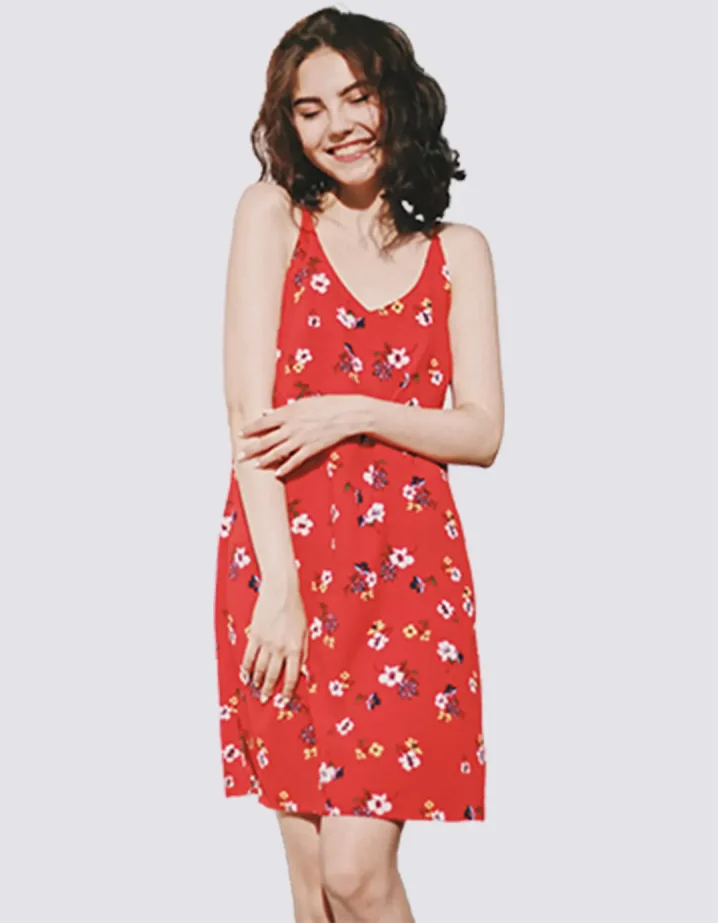 a girl in a red floral dress