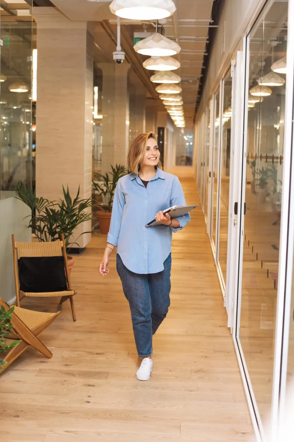 a woman walks through the office