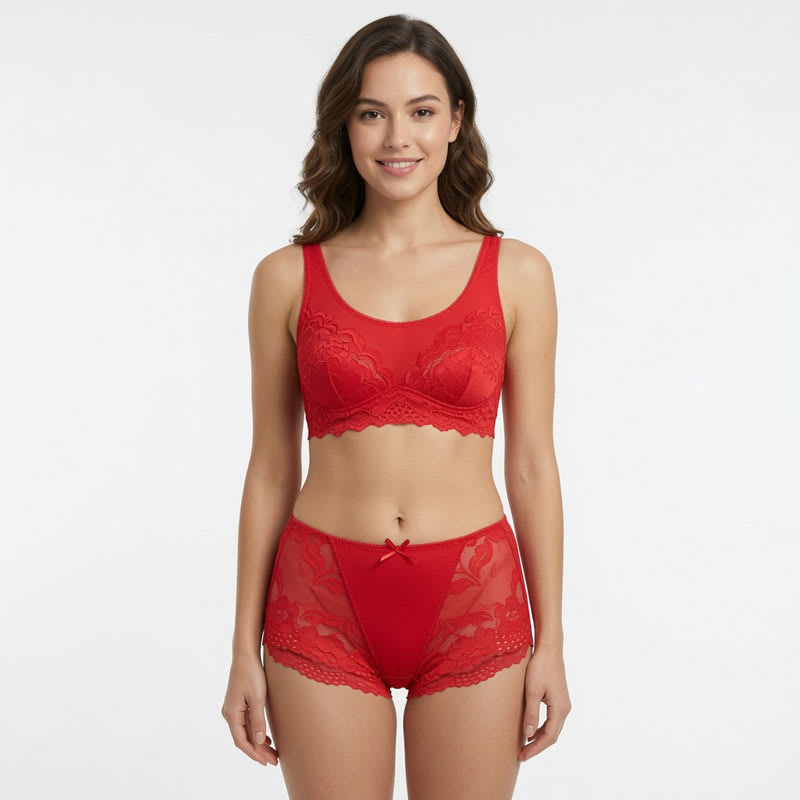 Red women’s lace mid waist panties with floral mesh panels, bow detail, and hollow lace trim on a white background.