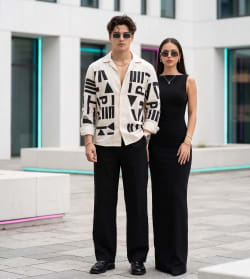 Cosmopolitan Elegance: Luxury Urban Editorial Duo in Neon-Lit Plaza