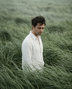  Solitude in Sage: A Wind-Swept Editorial Portrait