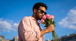 Golden Hour Elegance: Roses and Confidence Against Cobalt Skies