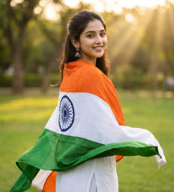 Patriotic Indian Woman Smiling in Golden Hour Park with National Flag