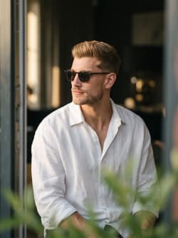 Candid Editorial Portrait of Man in White Shirt and Sunglasses