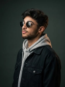 Cinematic Studio Portrait of Man in Sunglasses and Denim Jacket