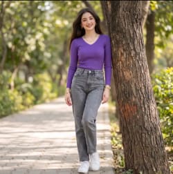Full Length Outdoor Fashion Portrait of Woman Leaning Against Park Tree