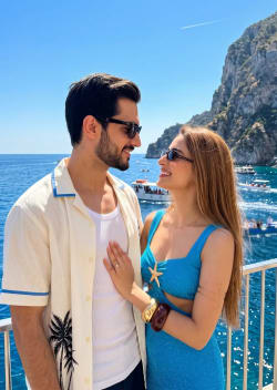 Young Couple Romantic Vacation Portrait at Sunny Coastal Promenade Overlook