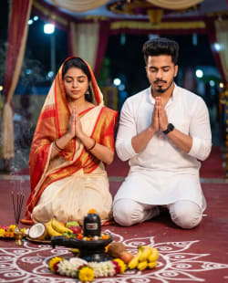 Realistic Indian Couple Kneeling in Nighttime Hindu Devotional Prayer Ceremony