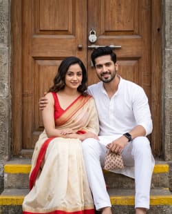 Authentic Indian Couple Seated on Step in Traditional Ethnic Wear